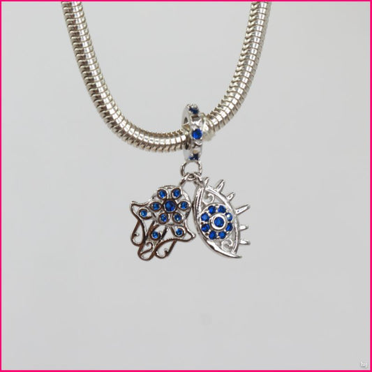 Charm Doble “Mano de Fátima y Ojo Protector”: Un Toque de Elegancia y Protección ✨